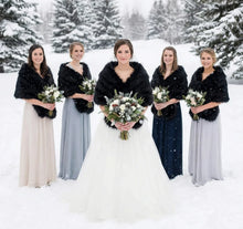 Load image into Gallery viewer, Black faux fur wrap worn by bridesmaids at a wedding, sleek and stylish stole for winter weddings