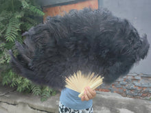 Load image into Gallery viewer, Black ostrich feather fan, dramatic and elegant handheld fan for burlesque shows, stage performances and themed parties