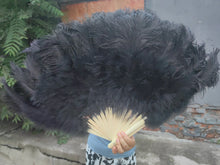 Load image into Gallery viewer, Black ostrich feather fan, bold and striking fan for burlesque shows, stage performances and events