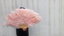 Load image into Gallery viewer, Person holding a large pink feathered fan against a plain background