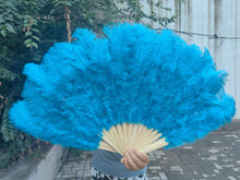 Load image into Gallery viewer, Bright turquoise ostrich feather fan, vibrant fan for stage performances, festivals and themed parties