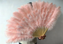 Load image into Gallery viewer, Close-up of champagne pink ostrich feather fan, detailed view of the fan’s handle and fluffy feathers for events and performances