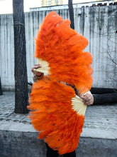 Load image into Gallery viewer, Orange ostrich feather fan, warm and vibrant handheld fan for performances, events and themed parties