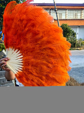 Load image into Gallery viewer, Orange ostrich feather fan, warm and vibrant handheld fan for performances, events and themed parties