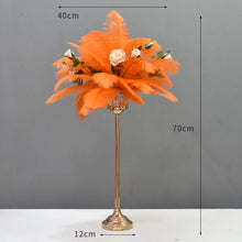 Load image into Gallery viewer, Tall wedding centerpiece featuring white ostrich feathers in a gold Eiffel Tower vase for a luxury reception.