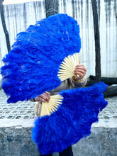 Load image into Gallery viewer, royal blue ostrich feather fan in use, vibrant fan for performances, photoshoots and events