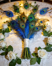 Load image into Gallery viewer, Peacock feather centerpiece with white flowers, luxurious table decor for weddings, banquets and special occasions