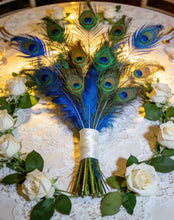 Load image into Gallery viewer, Peacock feather centerpiece with white flowers, luxurious table decor for weddings, banquets and special occasions