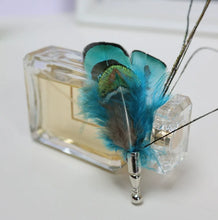 Load image into Gallery viewer, Vibrant blue peacock feather fly fishing lure, lifelike design for bass and trout angling.