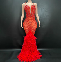 Load image into Gallery viewer, Red evening gown with feathered skirt on a mannequin against a black background