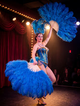 Load image into Gallery viewer, A showgirl performing on stage with vibrant royal blue ostrich feather fans.