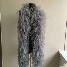 Load image into Gallery viewer, A luxurious silver ostrich feather centerpiece with candles at a formal wedding event.