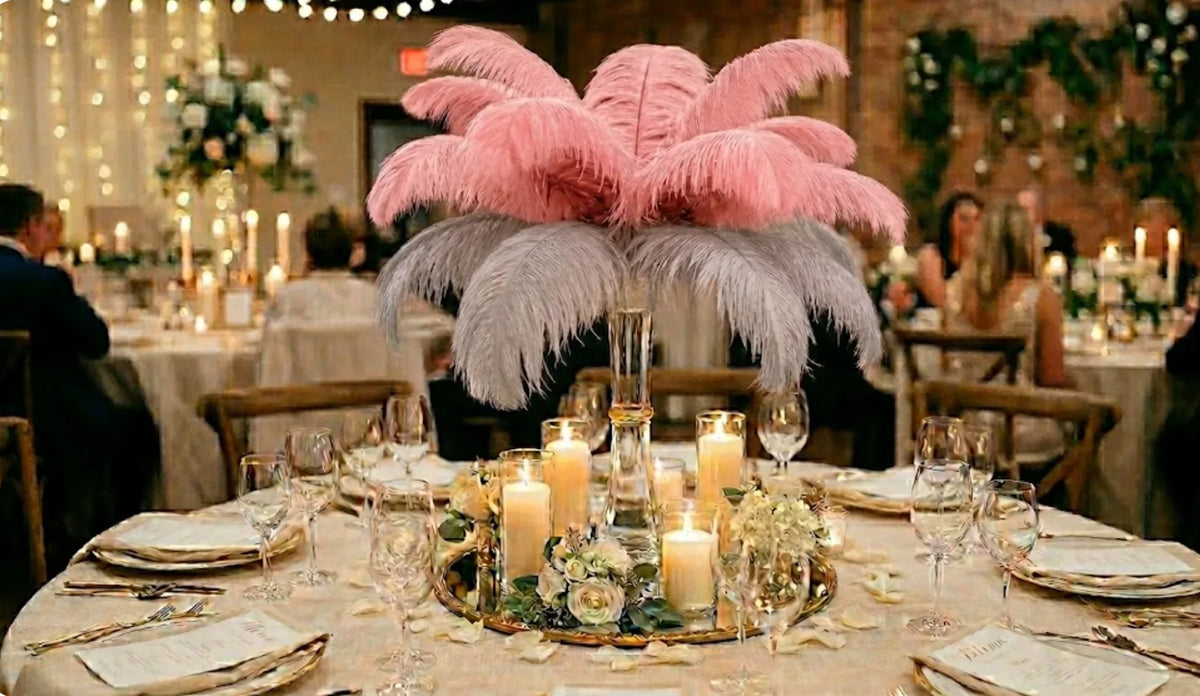 Chic silver and blush pink ostrich feather centerpiece, elegant table decoration for a romantic wedding.