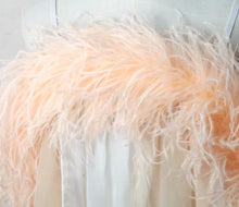 Load image into Gallery viewer, Model wearing a blush pink ostrich feather boa for a vintage 1920s Gatsby party or burlesque performance.
