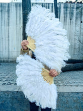Load image into Gallery viewer, White ostrich feather fan in use, showing its full spread and fluffy texture for performances and events
