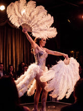 Load image into Gallery viewer, White ostrich feather fans held by a burlesque dancer on stage