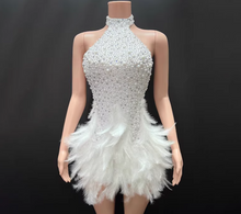Load image into Gallery viewer, Mannequin wearing a white beaded and feathered dress against a black background