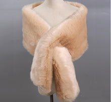 Load image into Gallery viewer, A nude-colored faux fur stole wrap displayed on a mannequin, with the fur extending in a dramatic sweep to the floor.