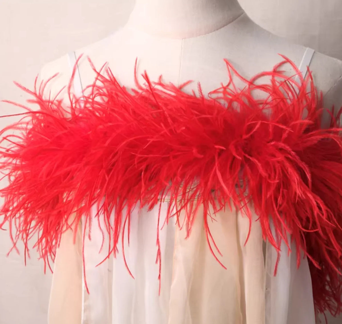 
Premium red ostrich feather boa, 2 yards long, multi-ply for maximum volume and soft texture.