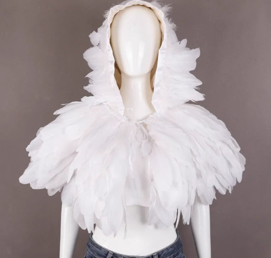 Mannequin wearing a white hooded garment with feather-like details on a gray background