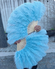 Load image into Gallery viewer, A pair of large Aqual Ostrich Feather Fans for burlesque dancing and stage performance.
