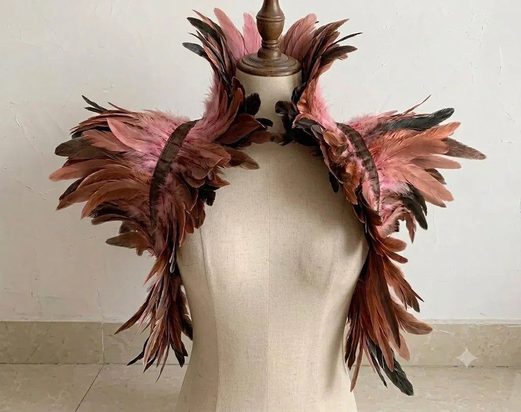 A romantic blush nude feather capelet bridal shrug designed for wedding dresses.