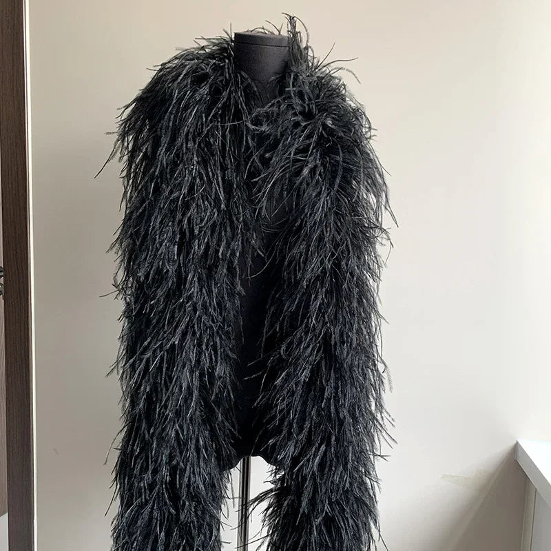 Black ostrich feather boa wrap displayed on a black mannequin torso