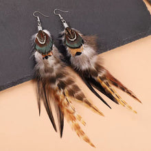 Load image into Gallery viewer, Close-up of handmade feather earrings featuring bead accents
