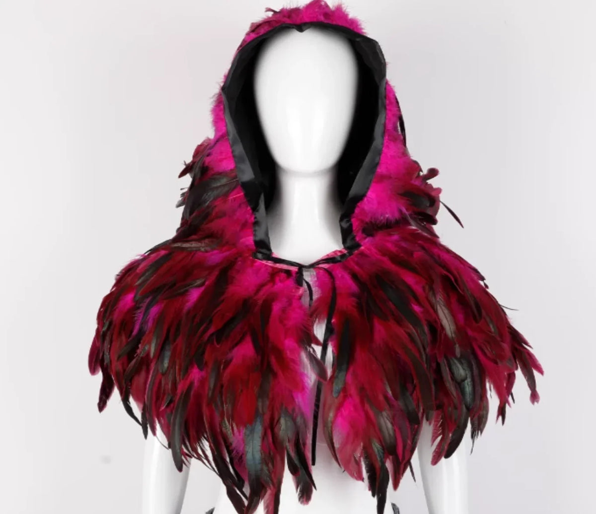 Mannequin wearing a vibrant pink feathered hood against a white background