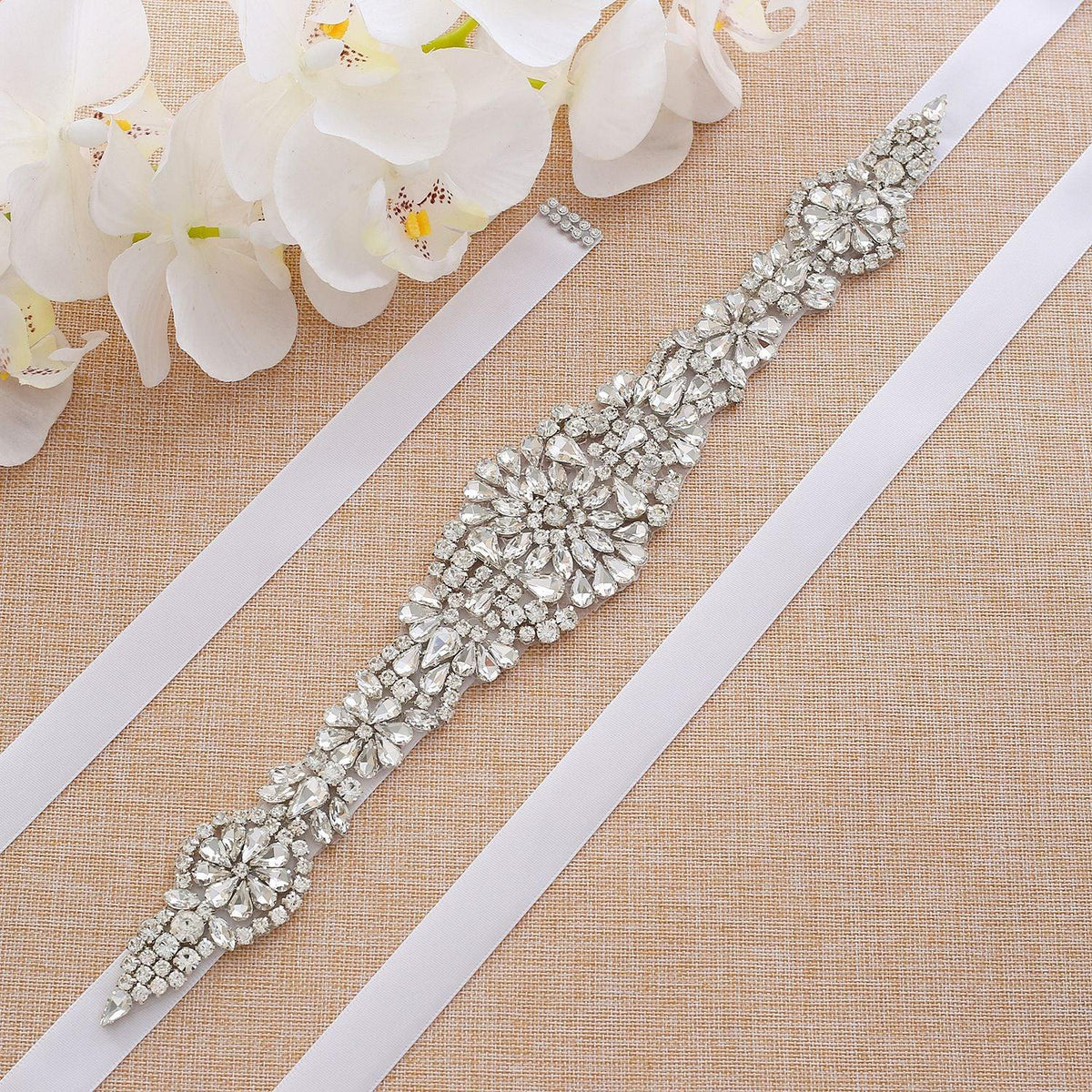 Exquisite floral pattern rhinestone bridal belt with shimmering crystals, perfect for a garden wedding dress.