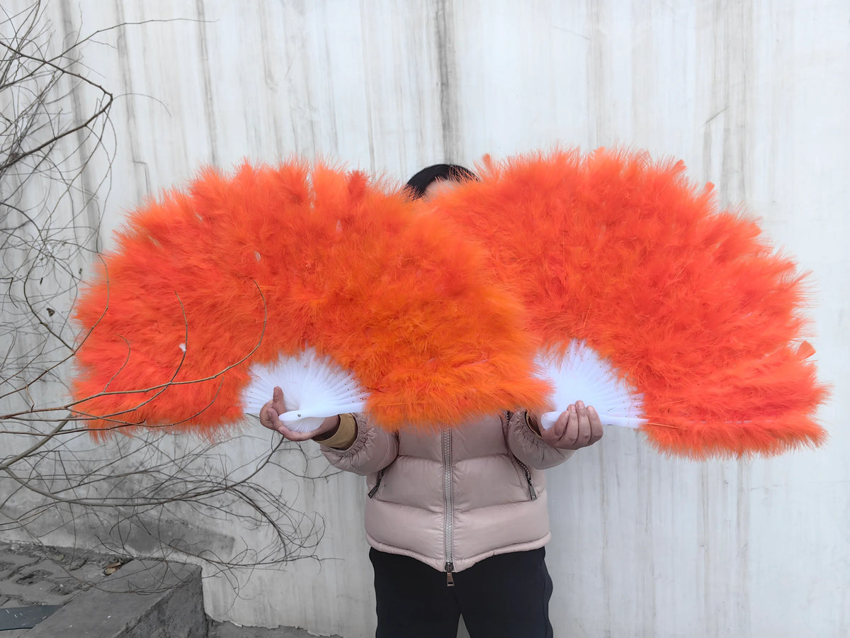 vibrant orange marabou feather fan, showing its fluffiness and design details