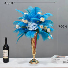 Load image into Gallery viewer, A bouquet of turquoise blue ostrich feathers arranged in a tall, elegant vase, with measurements indicating the height of the feathers.
