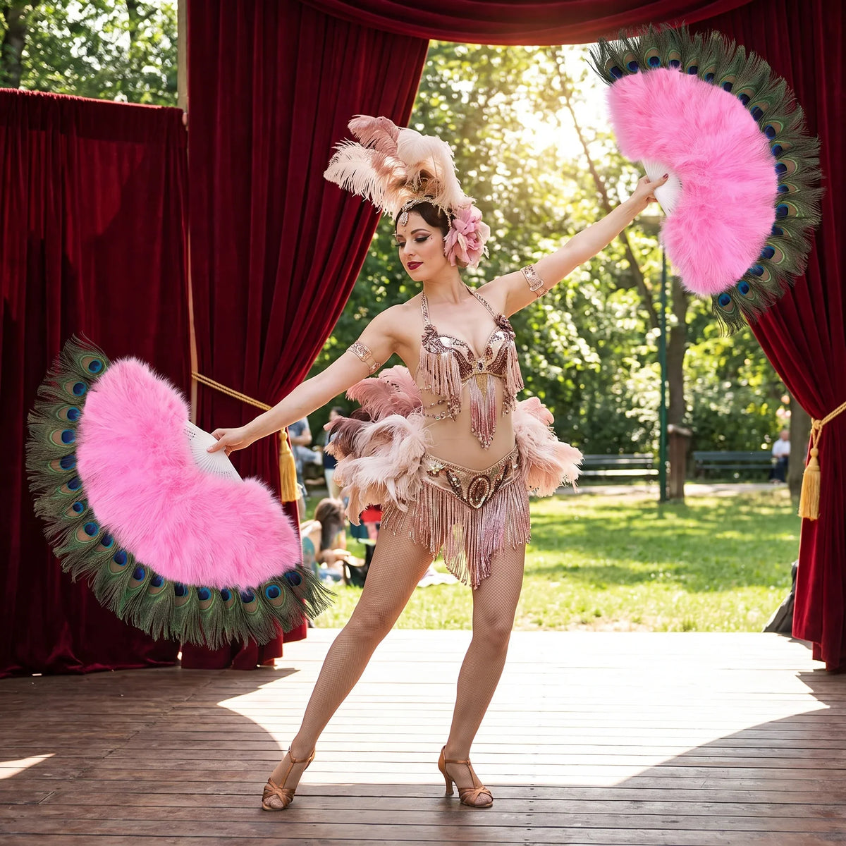 Burlesque dancer in a gold costume holding pink ostrich feather fans on a stage.