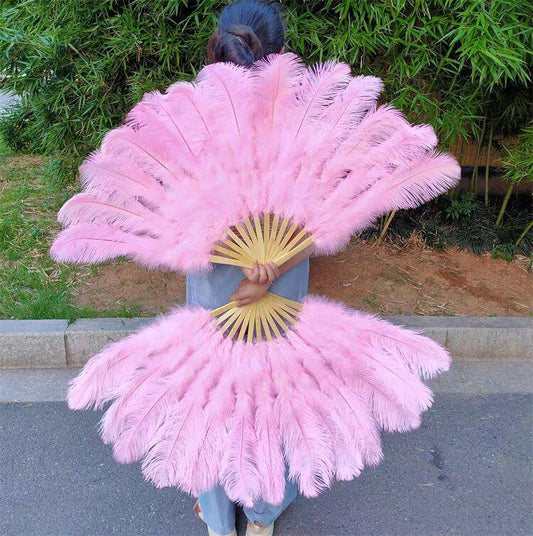 pink ostrich feather fan, showing how the fan opens and moves for burlesque performances