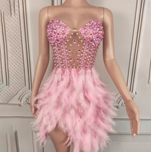 Load image into Gallery viewer, Pink beaded and feathered dress on a mannequin against a decorative wall.
