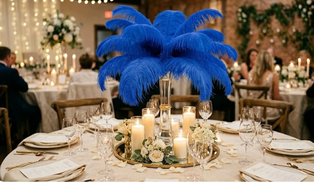 Vibrant royal blue ostrich feather centerpiece with warm candle lighting for a themed banquet.