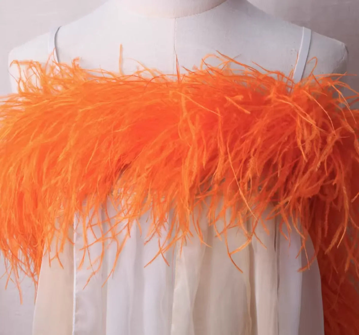 Premium orange ostrich feather boa, 2 yards long, multi-ply for maximum volume and soft texture.