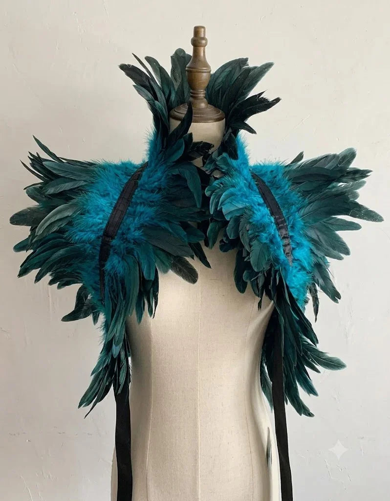A striking turquoise blue layered feather capelet shoulder wrap for festivals and stage wear.