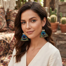 Load image into Gallery viewer, Model wearing turquoise and natural feather statement earrings
