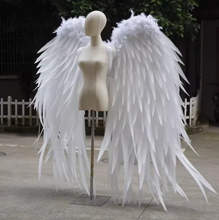 Load image into Gallery viewer, Large white feather angel wings displayed outdoors, elegant costume wings for weddings, photoshoots, and special events.
