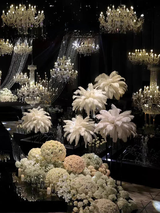Variations of white ostrich feathers for wedding centerpieces, showing different arrangements for events and special occasions